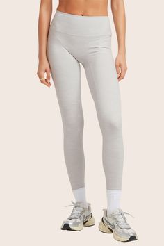 Experience style and comfort with the 2024 FormCloud™ Leggings in Heather Grey. These high-waisted leggings offer a smooth texture, medium compression, and are made from our proprietary FormCloud™ fabric. With no side or front seams, they provide a sleek look for your active pursuits. Gray Compression Elastane Leggings, Gray Compression Leggings, Gray Compressive High Waist Pants, Gray Compressive High Waisted Pants, Compressive High Waist Gray Pants, Compressive High-waisted Gray Pants, Gray Full Length Micro-elastic Yoga Pants, Fitted Gray Tights For Pilates, Gray Seamless Athleisure Bottoms