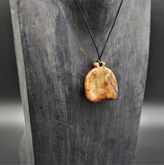 "Prices given are total prices. VAT is not shown due to small business status according to § 19 UStG." A fancy pendant which was made of beautiful real wood. On the front of the pendant, a naturally occurring indentation in the wood was filled with blue pigments, which provide a special contrast and a great play of colors. A delicate line filled with blue pigments can also be seen on the back. The wood is natural and not colored, has been elaborately processed, sanded and polished by hand. For a Adjustable Nature-inspired Necklace For Gift, Handmade Nature-inspired Necklace For Gift, Handmade Artisan Necklace For Gifts, Handmade Nature-inspired Necklaces With Round Pendant, Handmade Nature-inspired Round Pendant Necklaces, Handmade Nature-inspired Pendant Necklace, Artisan Adjustable Necklaces For Gifts, Unique Handmade Charm Necklaces With Pendant, Unique Adjustable Pendant Charm Necklace