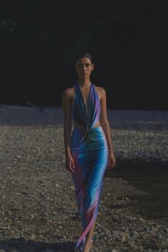 Introducing the "Odette Dress" in Interstellar – make a bold statement with this deep V-neck maxi dress that ties at the neck, featuring side cutouts and an open back. The Baobab shape embellishment creates a stunning ruched effect at the front, adding texture and enhancing the silhouette. Ideal for summer soirées or beachside dinners, this dress exudes elegance and allure. Elegant Cutout Dress, Odette Dress, Bleecker Street, Interstellar, Spring Wardrobe, Cutout Dress, Summer 24, Deep V Neck, Skirt Pants