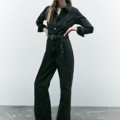 Long Lapel Collar Jumpsuit With Long Cuffed Sleeves. Self-Belt With Metal Buckle. Front Metal Button Closure. Anthracite Grey | 8197/252 13 Outer Shell 100% Cotton Black Denim Overalls For Fall, Black Denim Overall Jumpsuit For Spring, Spring Black Denim Overall Jumpsuit, Black Denim Overall Jumpsuit For Fall, Black Denim Jumpsuit With Pockets For Fall, Black High-waist Jumpsuits And Rompers For Fall, Black High Waist Jumpsuits And Rompers For Fall, Black Denim Jumpsuit For Work, Fitted Denim Jumpsuits And Rompers In Black