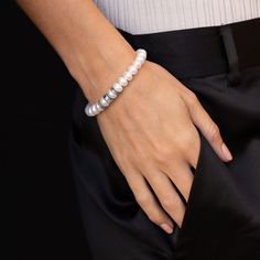 Sterling silver White pearl; diamonds, approximately 0.18 carats 8mm smooth round beads: 1 - 8mm silver rondelle and 2 - 8mm diamond rondelles 7 1/2" long bracelet; Inner circumference of 6 ¼ inches Slip-on style Designed and handmade in California Style number: B0004035 Long Bracelet, Stacked Necklaces, Id Bracelets, California Style, White Pearl, Pearl Bracelet, Men Necklace, Black Diamond, Round Beads