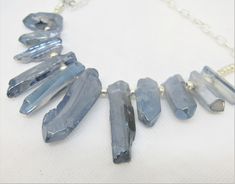 "I LOVE these LUSTER FINISH IRREGULAR GRADUATED SPIKES--I am not sure if they are glass or stone with a coating. They look like natural stone, but the finish is not quite like anything I have seen before. The color is a soft blue to blue-gray, and while each piece LOOKS rough and irregular, the finish is very smooth and glassy and shimmery. The beaded section of this necklace is a fan of these beads about 7\" wide. The shortest pieces are about 1\" long and the longest about 2\" long. It has a v Adjustable Blue Jewelry With Raw Stone, Adjustable Blue Raw Stone Jewelry, Adjustable Raw Blue Stone Jewelry, Useable Gifts, Star Wars Theme Party, Tote Outfit, Farmers Market Bag, Spike Necklace, Free Gift Tags