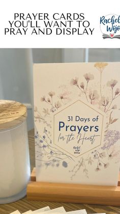 prayer cards displayed in front of a candle on a wooden stand with the words 31 days of prayer written below