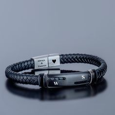 W E L C O M E  B L A C K E A G L E D E S I G N ! Bracelets Material 316 L Stainless Steel Black color stainless steel bar and black braided genuine leather If you have a problem with the product, you can write us a message without hesitation. Introducing our Custom Engraved Bracelet, a perfect personalized gift for him. Handcrafted with care, this steel bracelet is designed to make a statement. Whether it's an anniversary gift for your husband, a anniversary gift for your boyfriend, or even a Christmas gift for the special men in your life, this steel bracelet is sure to impress. Made from high-quality steel, this bangle features lava stone beads that add a touch of sophistication. The lava stones not only enhance the bracelet's appearance but also have unique properties. These natural sto Anniversary Gifts For Your Boyfriend, Men Leather Bracelet, Custom Engraved Bracelet, Boyfriend Personalized Gifts, Christmas Gift For Him, Gift For Your Boyfriend, Masculine Design, Personalized Gifts For Men, Stainless Steel Bar