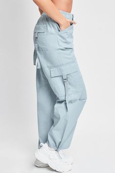 Add style, comfort, and versatility to your pant collection with our women’s elastic waist cargo pants. This relaxed-fit cargo pant is constructed with lightweight cotton fabric for maximum comfort and versatility. Our cargo pants for women have a relaxed leg, baggy fit from hip to hem, and are full-length with a draws Spring Cotton Cargo Pants With Cargo Pockets, Trendy Relaxed Fit Tapered Leg Cargo Pants, Solid Cargo Style Parachute Pants With Tapered Leg, Trendy Relaxed Fit Cargo Pants With Belt Loops, Spring Cotton Cargo Pants With Side Pockets, Spring Cotton Cargo Pants With Multiple Pockets, Relaxed Fit Cargo Pants With Cargo Pockets For Spring, Trendy Cotton Cargo Pants With Belt Loops, Solid Cotton Utility Cargo Pants