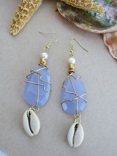 Aqua Chalcedony and freshwater pearl earrings with cowrie shells. Handmade Cowrie Shell Earrings As Gift, Handmade Cowrie Shell Earrings For Gift, Cowrie Shell Dangle Earrings As Gift, Cowrie Shell Dangle Jewelry Gift, Cowrie Shell Dangle Jewelry For Gifts, Unique Teardrop Jewelry For Beach, Handmade Blue Mother Of Pearl Jewelry, Ocean-inspired Blue Shell Jewelry, Blue Shell-shaped Jewelry For Vacation