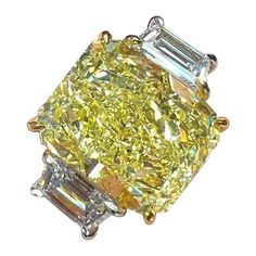 This fancy yellow radiant cut diamond is offered by Antinori di Sanpietro ROMA. This 4ct fancy light yellow radiant diamond is custom set in a handcrafted Antinori di Sanpietro ROMA platinum and 18 karat yellow gold. 3 stone ring consisting of 1 radiant cut fancy yellow diamond weighing 4.02 carats with VVS2 clarity accompanied by GIA report, accented by 2 side diamonds with a total weight of approximately 1 carat, and a respective color and clarity of E-F VS1-VS2 quality. Dazzling Brilliant Cut Yellow Diamond Ring, Dazzling Yellow Brilliant Cut Diamond Ring, Gia Certified Rectangular Gold Diamond Ring, Yellow Diamond Ring With Cushion Cut, Yellow Emerald-cut Diamond Wedding Ring, Dazzling Yellow Diamond Ring With Accents, Fine Jewelry Yellow Diamond Cut Ring, Luxury Radiant Cut Yellow Rings, Luxury Yellow Diamond Ring