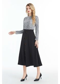 Our Black Midi Skirt with Front Button Detail is the perfect blend of sophistication and style. Crafted from high-quality denim fabric, this skirt is soft to the touch and comfortable to wear. It features a midi length, which falls below the knee, making it perfect for both casual and formal occasions. The skirt is designed with a button detail that runs down the front of the skirt, adding a touch of elegance and femininity to the overall design. The skirt also features a hidden back zipper clos Chic Fall Skirt With Button Zip Fly, Chic Skirt With Button Zip Fly For Fall, Workwear Bottoms With Button Closure And Midi Length, Chic Workwear Skirt With Button Closure, Fall Office Skirt With Button Closure, Workwear Midi Skirt With Buttons, Chic Fall Skirt With Button Closure, Chic Workwear Skirt With Button Zip Fly, Casual Workwear Skirt With Button Closure