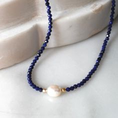 Natural Lapis Necklace for Women, Birthday Gifts for HerStunning and chic this beaded lapis lazuli necklace is the perfect everyday necklace or gift. Lapis is know as the friendship stone!•Gorgeous, genuine and natural 3mm lapis lazuli beaded by hand with freshwater pearl•Adorned with 14kt gold filled accents Water friendly Adjustable Single Strand Lapis Lazuli Necklace, Lapis Lazuli Beaded Necklaces For Gift, Single Strand Lapis Lazuli Beaded Necklace As Gift, Clothing Fancy, Women Birthday Gifts, Beaded Necklace Patterns, Lapis Necklace, Lapis Lazuli Necklace, Lapis Lazuli Beads