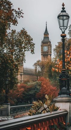 the big ben clock tower towering over the city of london, england in autumn time