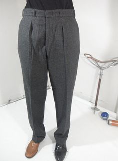 Vintage 100% pure wool, tailored made trousers, cuffed, belt loops, buttons on inside for suspenders, coin pocket, button closure on fly, length of trousers 40 in. Pristine, no wear or tear, no stains Person wearing the trousers is 5ft 6in, 27in waist & weighs 125 lbs. Classic Formal Pants For Winter, Formal Classic Pants For Winter, Classic Formal Bottoms For Winter, Classic Formal Winter Pants, Classic Dress Pants For Formal Winter Occasions, Classic Winter Dress Pants For Formal Occasions, Classic Formal Dress Pants For Winter, Classic Formal Winter Dress Pants, Classic Wool Dress Pants With Belt Loops