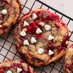 cookies with white chocolate chips and cranberry filling on a cooling rack, ready to be eaten