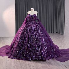 Experience a regal sensation in our exquisite deep purple party ball gown, adorned with luxurious and vibrant multi-colored sequined designs. The stunning sweetheart neckline and fitted bodice add a touch of elegance, while the satin ribbon lace up back allows for a comfortable and customizable fit. Complete with a sweeping train, this gown is sure to make a statement. material: organza color: as shown type: party ball gown built in bra sweetheart neckline off the shoulder long drape train as shown lace up back original photos Royal Purple Ball Gown, Dark Purple Quince Dresses, Dark Purple Ball Gown, Purple Ballgown, Sweetheart Neckline Off The Shoulder, Quinceñera Ideas, Purple Ball Gown, White Quinceanera Dresses, Purple Quinceanera Dresses