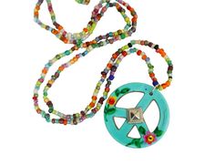 A unique and artful turquoise peace sign pendant featuring a hand-painted floral design dangles whimsically from a long, beaded necklace to add colorful Boho style to any outfit! And from inside the painted flowers, tiny crystal rhinestones add a touch of sparkle! Super cute piece of wearable art for you and maybe a little gift for a friend...buy 2 at a discount! Beaded Seed Bead Necklace, 28", Ceramic Peace Sign Pendant, 1 1/4" round  MANY ARTFUL ITEMS ARE AVAILABLE IN MY SHOP! VISIT MY SHOP GODDESS ARTS COLLECTION www.etsy.com/shop/goddessartcollection                          SPECIAL SHIPPING RATES!!                         FREE US SHIPPING(certain items excluded)                         REDUCED INTERNATIONAL & CANADA  **CUSTOM ORDERS WELCOMED** Put my brush and skill to work for you! s Beaded Peace Sign, Colorful Boho Style, Colorful Boho Fashion, Hand Painted Jewelry, Hand Painted Flowers, Painted Flowers, Seed Bead Necklace, Bohemian Fashion, Colorful Boho