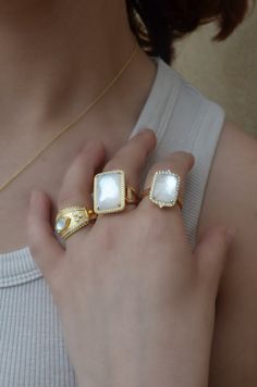 18k yellow gold with 60 round diamonds, 0.26Tw, and one mother of pearl with clear quartz on top, 11.64Tw. Size 6.5. Can be sized. Heirloom Stackable White Jewelry, Luxury Gemstone Open Ring Jewelry, Timeless White Jewelry With Vs Clarity, Diamond White Stackable Ring Jewelry, Elegant Stackable Moonstone Ring With Diamond, Luxury Yellow Gold Plated Ring, Timeless White Rings With Vs Clarity, Luxury Diamond White Stackable Jewelry, Elegant White Gemstone Signet Ring