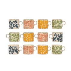 six cups with different designs on them are lined up in a row, one is orange and the other has green leaves