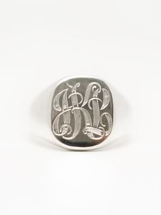 Introducing our timeless monogram signet ring, a true symbol of personalized style and sophistication. Crafted from high-quality materials, this ring features our classic signet design with a flat surface for your personalized monogram engraving. Choose up to three letters to create a unique and personal design that is both stylish and meaningful. Whether you want to display your initials or those of a loved one, this monogram signet ring is the perfect accessory to wear on any occasion. Made to Signet Ring Design, Signet Ring Silver, Dream Wishlist, Silver Signet Ring, Silver Wedding Rings, Personalized Monogram, Recycled Sterling Silver, Hand Engraving, Flat Surface