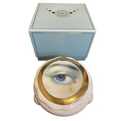 a toilet with an eye painted on the lid