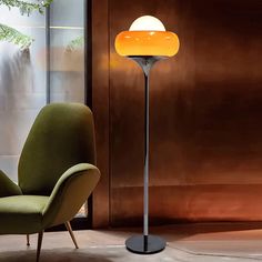 a modern floor lamp in the corner of a room with a chair next to it