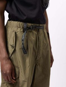 Introducing the and wander oversized cargo pants in khaki - perfect for those who appreciate a good adventure! made from a water-resistant ripstop material these pants boast a one-of-a-kind stretch and hue thanks to the innovative use of split yarn.    featuring a roomy and relaxed fit these cargo pants are ideal for the free-spirited and wild at heart.    article fit & features  —    — material: 67% polyester / 33% nylon  — water-resistant ripstop  — fit: roomy and relaxed fit Luxury Green Utility Parachute Pants, Khaki Wide-leg Parachute Pants With Multiple Pockets, Khaki Cotton Cargo-style Parachute Pants, Cotton Military Parachute Pants For Outdoor, Oversized Cargo Pants, Military Parachute Pants With Cargo Pockets For Outdoor, Wild At Heart, Free Spirited, Mens Trousers