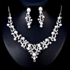 a necklace and earring set with pearls