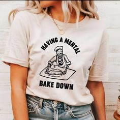 "Having A Mental Bake Down Shirt, Gift For Bakers,  Skeleton Chef Shirt,  Chef Halloween Shirt,  Funny Baking Shirt, Halloween Chef Shirt,  Our T-shirts are made from premium materials and printed using advanced technology to ensure exceptional quality and comfort. Features: Premium brand: Gildan Soft Style Professionally printed using advanced technology Unisex size for a comfortable fit Made from soft, breathable cotton for all-day comfort Durable construction to withstand repeated wear and tear Easy Ordering: 1.Browse our design options. 2.Choose your size and color. 3.Choose the quantity you want. 4.Click \"Add to Cart\" to complete your purchase. Order Fulfillment: 💍Production time: 1-2 business days 💍Shipping time: 3-5 working days after production Return Policy: 💍Returns and exch