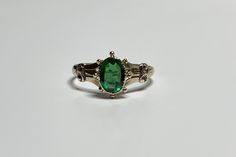 Stunning antique circa 1900s Edwardian era 10k rose gold created green tourmaline ring! This timeless statement ring has a 10k rose gold setting. In the center is an oval faceted created green tourmaline gemstone, that is approximately .76 carats. The green stone is securely bezel set, and there is a beautiful designs down the shoulders. A fantastic piece of fine Edwardian era jewelry, from the early 1900s! ERA - Circa 1900s / Edwardian METAL / MATERIAL - 10k rose gold, created green tourmaline Antique Emerald Ring For Formal Occasions, Antique Emerald Ring For Formal Events, Vintage 14k Gold Ring With May Birthstone, Vintage 14k Gold Ring For May Birthstone, Vintage 14k Gold Rings With May Birthstone, Antique 14k Gold Emerald Ring For Formal Occasions, Victorian Style Emerald Cut Emerald Ring For Formal Occasions, Vintage Green May Birthstone Ring, Antique Engraved Emerald Ring For Formal Occasions