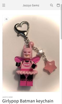 a pink lego keychain with a heart on it