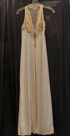 Vintage Glydons Hollywood Small Lace Bodice Full Nightgown Slip Description Beautiful Glydons Hollywood Vintage Women's Lace Full Slip Nightgown Size: Small Color: Beige Material: Nylon Gorgeous, elegant.... nightgown slip. Delicate scalloped lace bodice. Slips over the head. This item is in very gently used condition. We hand select our used items very carefully and only list those with little to no obvious signs of wear. Items will arrive from a smoke-free/pet-free environment. Size Small Measures 13 inches from armpit to armpit laying flat 54 inches long from top of the shoulder to bottom hem Please feel free to message me with any questions and/or to request additional photos. Elegant Nightgown, Slip Nightgown, Hollywood Vintage, Vintage Nightgown, Women's Nightgowns, Nightgowns, Vintage Lingerie, Lace Bodice, Scalloped Lace