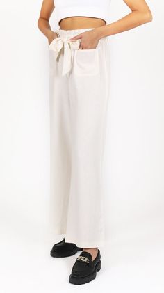 DETAILS Our Self Tie Wide Leg Pants are the perfect choice for a summer day. The light and breezy material are easy to wear, while the tie waist and wide leg design make these pants both stylish and comfortable. The tiered design is perfect for adding a touch of style to any look. Whether you're dressing up for a special occasion or simply looking for a chic choice for everyday wear, these pants are a must-have in your wardrobe. MEASUREMENTS Inseam: 32" Leg Opening 23 1/2" COMPOSITION & CARE 55% Button Fly Pants, Wardrobe Measurements, Leg Design, Summer Day, Summer Days, Leg Pants, Wide Leg Pants, Must Haves, Paper Bag