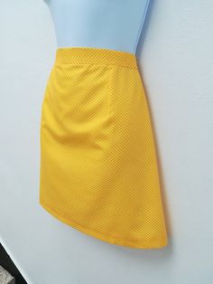 "NOELLE SKIRT Handmade skirt 65% Polyester 35% cotton Color: yellow This skirt is also available custom made! We need to know: waist, hips, length Sizes XS: CHEST 84 CM / WAIST 66 CM / HIPS 90 CM S: CHEST 88 CM / WAIST 70 CM / HIPS 94 CM M: CHEST 92 CM / WAIST 74 CM / HIPS 98 CM L: CHEST 96 CM / WAIST 78 CM / HIPS 102 CM XL: CHEST 100 CM / WAIST 82 CM / HIPS 106 CM XXL: CHEST 104 CM / WAIST 86 CM / HIPS 110 CM *Notice that the pictures are made by professionals and prepare for the best look on t Fitted Retro Style Mini Skirt, Fitted Retro Cotton Mini Skirt, Fitted Polka Dot Mini Skirt, Retro Cotton Mini Skirt, Retro Fitted Skort With Lined Skirt, Retro Fitted Lined Skirt, Fitted Retro Skirt, Fitted Polka Dot Skirt With Lining, Retro Cotton Skort