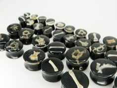 black and white marbles with different designs on them