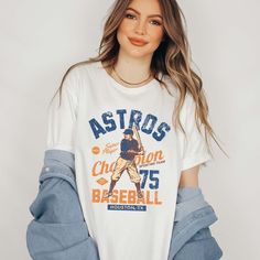 Step up to the plate in style with the "Vintage Baseball Team" Tee, showcasing iconic designs of your favorite baseball teams from the golden era of baseball. Crafted from premium fabric, this tee ensures both comfort and durability, making it perfect for honoring the rich history of America's favorite pastime. The vintage-inspired designs capture the nostalgia and heritage of classic baseball teams, bringing the spirit of the ballpark to your wardrobe. Whether you're cheering from the stands or Throwback Graphic Print Top For Game Day, Game Day Baseball Jersey With Graphic Print, Throwback Relaxed Fit Tops For Game Day, Cotton Baseball Jersey With Team Logo, Relaxed Fit Throwback Tops For Game Day, Throwback Cotton Baseball Jersey For Game Day, Throwback Relaxed Fit T-shirt For Fan Merchandise, Throwback Relaxed Fit T-shirt For Fans, Baseball Season Cotton Jersey With Team Logo