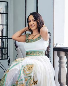 The Habesha dress, also known as Habesha Kemis, is an exquisite example of Ethiopian traditional dress. Perfect for weddings, this stunning attire features a delicate beaded design in light colors, showcasing the elegance and cultural heritage of Ethiopia. Material Cotton Menen Thread Estimated delivery : 1 week to 2 weeks Contact WhatsApp +1(304)-306-2784Email: contact@ethiopian.store Ethiopian Wedding, Habesha Dress, Ethiopian Dress, Habesha Kemis, Dresses Xxl, Wedding Dresses Simple, Traditional Dress, Cultural Heritage, Traditional Dresses