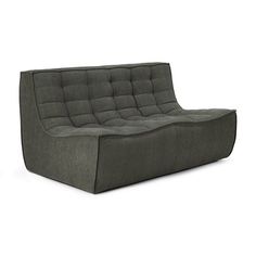 a gray couch sitting on top of a white floor