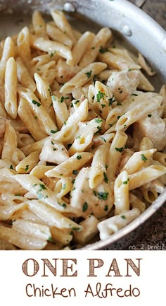 pasta with chicken and parsley in a pan