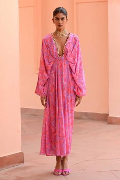 Lilac, pink kaftan with floral print and sequin embroidered neckline.
Components: 1
Pattern: Printed, Embroidery
Type Of Work: Floral
Neckline: Plunge V neck
Sleeve Type: Kaftan sleeves
Fabric: Crepe
Color: Purple,Pink
Other Details: 
Gathered waistband
Occasion: Resort - Aza Fashions Kaftan Sleeves, V Neck Kaftan, Kaftan Women, Kaftan Pattern, Kaftan For Women, Crepe Skirt, Crepe Skirts, Heart Fashion, Embroidered Neckline