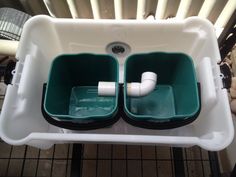 two plastic containers with toilet paper in them