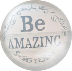 a white ball with the words be amazing painted on it's side and an ornate border