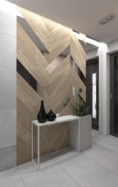 a vase sitting on top of a table in front of a wall with chevron wood panels