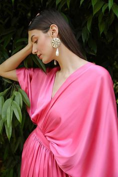 Colour : Bubble Gum PinkFabric : SatinDetails :Kimono sleeves, Fitted Waist, Side Zip & Hook for closure.Length : 59 inchesTHE MEASUREMENTS ARE IN INCHES Shoulder Bust Waist Low Waist Hips Armhole Extra Small 14 34 27 29 38 14 Small 14.5 36 29 31 40 15.5 Medium 15 38 31 33 42 16.5 Large 15.5 40 33 35 44 17.5 XL 16 42 35 37 46 18.5 XXL 17 44 37 39 48 19.5 Care• Dry Clean Only• Do Not Bleach• Steam Iron OnlyThis item is Made-To-Order. Please allow up to 21 working days for us to make your bespoke Silk V-neck Kimono For Daywear, Pink V-neck Kaftan For Evening, Elegant Pink V-neck Kimono, Elegant V-neck Kimono For Spring, Pink Floor-length Dress With Draped Sleeves, Pink Floor-length Dresses With Draped Sleeves, Elegant Pink V-neck Kaftan, Draped Kaftan For Wedding, Pink Feminine Dress With Draped Sleeves