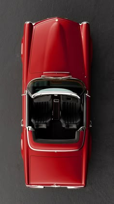 an overhead view of a red sports car