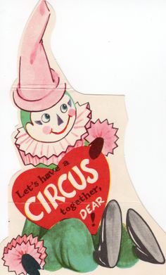 a close up of a paper cut out of a clown holding a heart with the words circus written on it