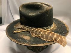 Hard Road Black 4 1/4 Crown, 3' Brim Custom Color, Distressing, Accessories and Band Although each hat is unique a similar hat can be made in various sizes. RevRanHat Size Chart Small - 6 7/8 Medium - 7 1/8 Large - 7 3/8 XL - 7 5/8 All Sales Final Fitted Brimmed Rustic Fedora, Rustic Fitted Fedora With Flat Brim, Rustic Fitted Felt Hat With Curved Brim, Rustic Brimmed Felt Hat, Rustic Fitted Felt Hat With Flat Brim, Rustic Fitted Felt Hat With Wide Brim, Custom Fitted Hat With High Crown, Vintage Black Handmade Top Hat, Black Top Hat For Fall Rodeo