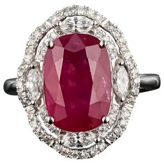 A stunning, certified, vivid red 5.40 carat Burmese heated Ruby and Diamond ring, set in 18K White Gold. The ring is currently sized at US size 7, and can be resized. The color of the center stone is ideal, and has great luster and is transparent. This deal is not to be missed, as this stone is a great investment! We provide free shipping, and accept returns. Please feel free to message us for more information! Gia Certified Ruby Ring, Luxury Marquise Red Ruby Ring, Luxury Red Marquise Ruby Ring, Exquisite Oval Ruby Ring Gia Certified, Luxury Oval Diamond Ring With Lab-created Ruby, Red Emerald Cut Diamond Rings, Luxury Red Ruby Gemstone Ring, Gia Certified Cushion Cut Ruby Ring For Formal Occasions, Exquisite Gia Certified Ruby Diamond Ring