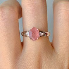 This gorgeous, timeless ring features our favorite Strawberry Quartz design and hand picked crystals. Libra is the zodiac sign of strawberry quartz. For those who are born from September 23 to October 22, things you would want to let go, such as possessiveness and indecisiveness, will disappear with the gem. The romantic within you will wake up and find opportunities to seek love when the stone is by your side. the crystal awakens new talents such as music and painting or writing. ✦ DETAILS ✦ ✧ Rose Quartz Crystal Ring In Rose Gold, Rose Quartz Crystal Ring For Promise, Promise Ring With Rose Quartz And Gemstone Detail, Rose Quartz Crystal Ring Gift, Pink Morganite Jewelry For Promise, Pink Morganite Jewelry With Gemstone Accents, Rose Gold Sterling Silver Birthstone Crystal Ring, Rose Gold Tourmaline Jewelry With Accent Stones, Rose Gold Crystal Ring With Birthstone In Sterling Silver