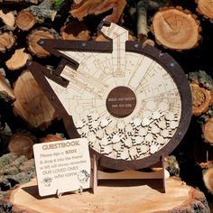 a star trek map on top of a tree stump with a sign in front of it