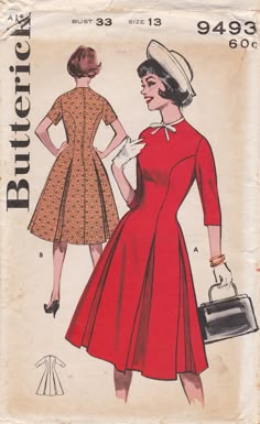 a woman in a red dress and hat is holding a purse