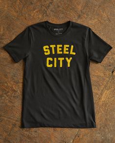 Featuring the classic logo on an exceptionally soft cotton tee. This 4.2 oz soft cotton tee is preshrunk with a unisex fit. Our Classic Tees are dyed, cut, designed and screen printed in the USA 🇺🇸 City Logo, Steel City, Black White Gold, Simple Shirts, Classic Logo, Black Tee, Cotton Tee, White And Black, Screen