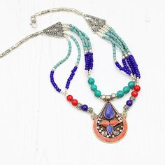 Handmade, boho style necklace for admirers of tribal and ethnic style jewellery. Specifications:Coral, Turquoise, Lapis, Ceramic beadsLength:  46 cm / 18 inchesPendant height: 6 cm / 2.4 inchesPlease note this is a handmade item crafted by Tibetan artisans, so minor imperfections are present. It makes this piece truly unique and the only one of its kind.If you have any questions feel free to message me :)EvelinaSHIPPING: First class (UK), International standard (outside UK)For more Tibetan neckl Adjustable Large Pendant Necklace For Festivals, Handmade Artisan Turquoise Necklace For Festivals, Multicolor Handmade Turquoise Necklace For Festivals, Traditional Multicolor Beaded Necklace With Large Pendant, Traditional Multicolor Turquoise Necklace For Festival, Spiritual Turquoise Pendant Necklace For Festival, Nickel Free Pendant Necklace For Festivals, Nickel-free Pendant Necklace For Festivals, Bohemian Round Bead Jewelry For Festivals